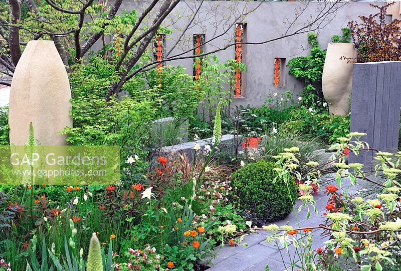 Fresh Garden - BrandAlley Garden - RHS Chelsea Flower Show 2013 - decorative back wall and bespoke sculptures placed in flower beds