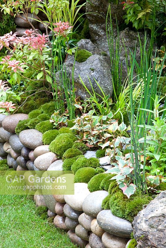 An Alcove Garden -  moss planting and pebble wall