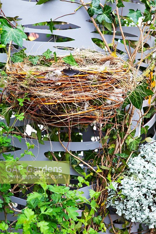 Birds Nest in 'Bird Columny' - installation by Jam Garden design within the Fresh Gardens avenue. Chelsea Flower Show 2013.