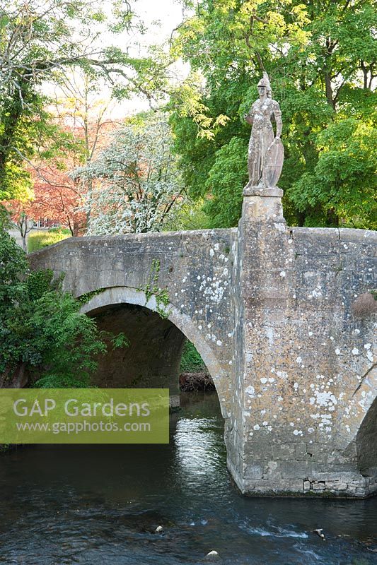 Bridge over the River Frome, 1400, with 18th century statue of Britannia installed by harold Peto. 