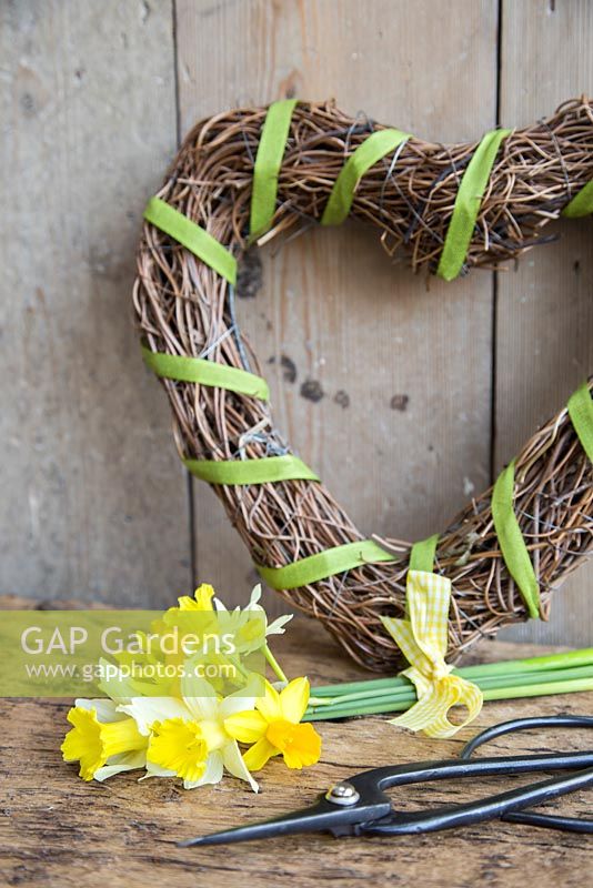 Narcissus bouquet with woven wreath and scissors
