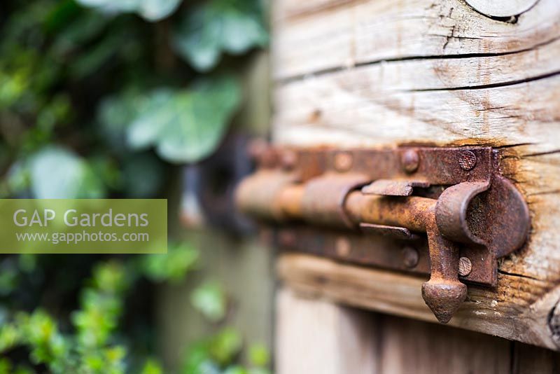 Rusted latch on garden gate