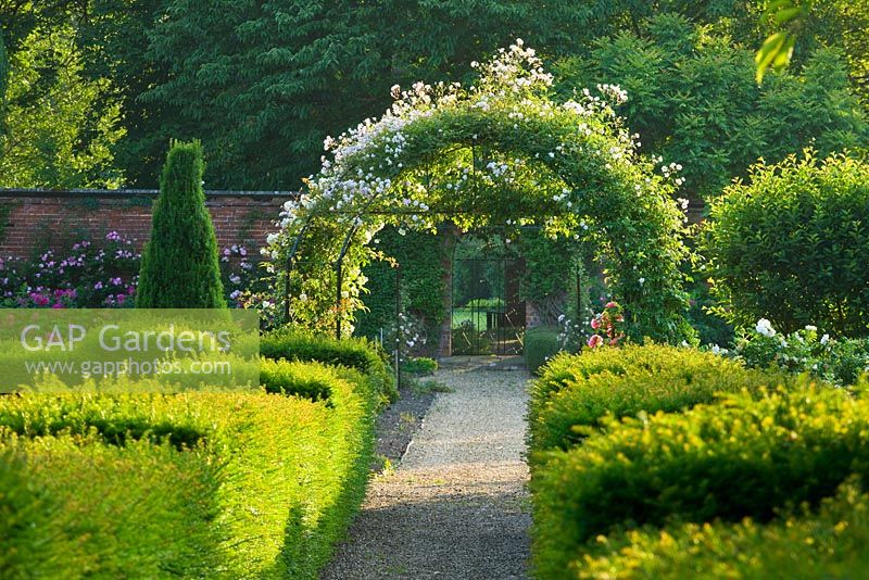 Formal country garden with archway - Little Ponton Hall Gardens, Lincolnshire 