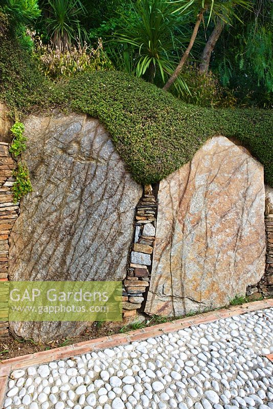 Massive rocks in the wall next to the main drive 