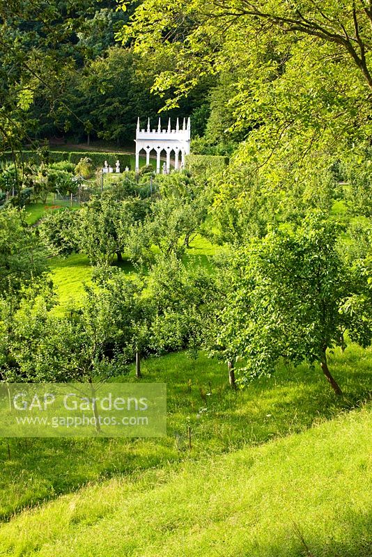 The exedra seen through trees. Painswick Rococo Garden, Gloucestershire 