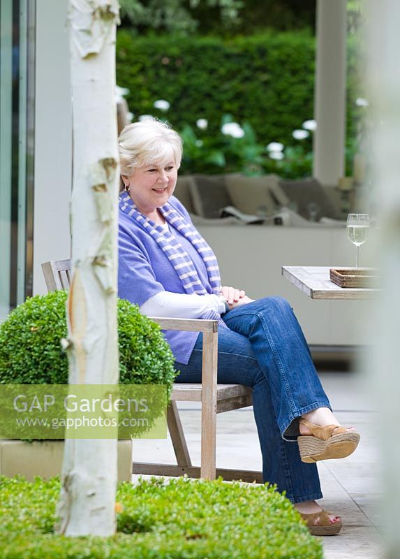 Garden owner Judy Gibbons - The Glass House - Architects Terry Farrell Partners - Garden design by Sallis Chandler 
 