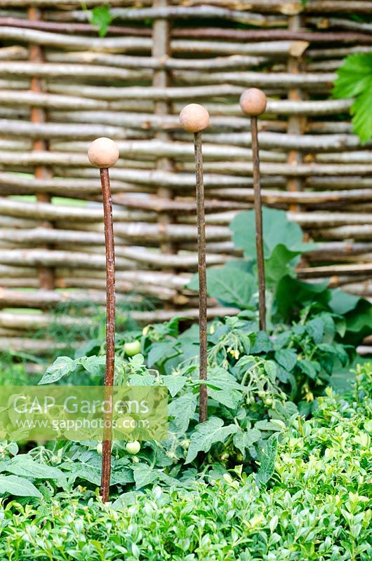 Metal plant supports for Tomatoes - Hedgehog Street, RHS Hampton Court Palace Flower Show 2014 - Design: Tracy Foster - Sponsor: People's Trust for Endangered Species, British Hedgehog Preservation Society