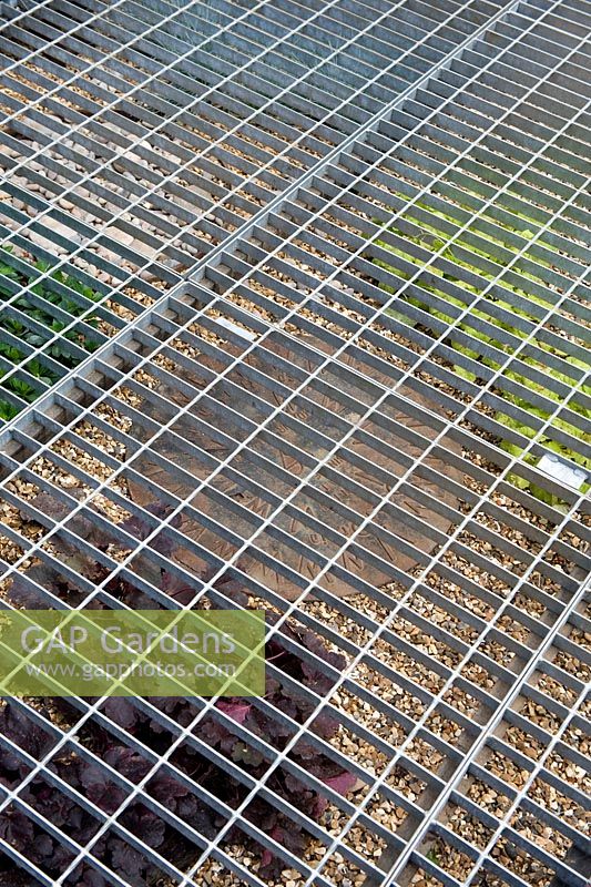 Summer garden Metal A Space to Connect and Grow detail of recycled mesh flooring over gravel  Designer: Jeni Cairns and Sophie Antonelli Sponsor: Metal Gold award best summer garden