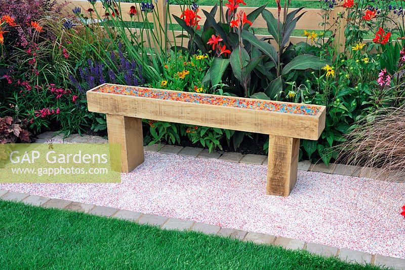 Solid wooden bench filled with coloured glass chippings. Description: The Narrows Garden. Designer: Phillippa Probert, Sponsor: Beers Building Supplies