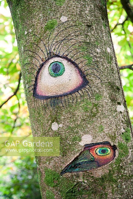 Someone's Watching Me by Peter Bye acrylic on tree. The Hannah Peschar Sculpture Garden designed by Anthony Paul, landscape designer