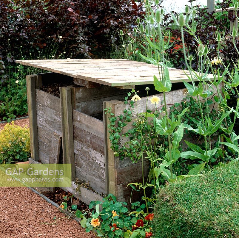 Wooden compost heap.