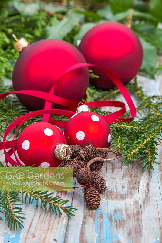 Red polkadot baubles with Ribbon, alder cones and yew foliage