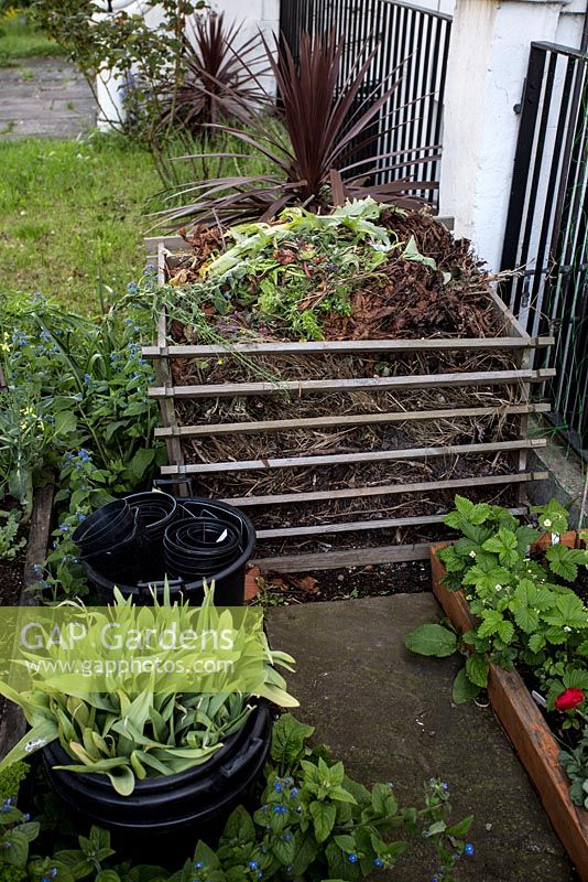 Compost heap in front garden, Brixton