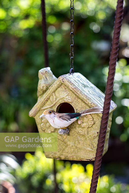 Ceramic bird house and decorative bird