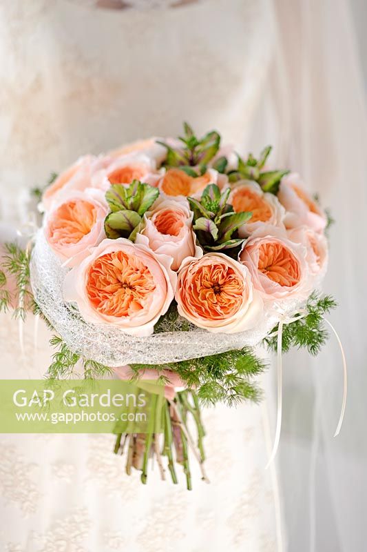 Peach roses in a wedding arrangement. Rose 'Juliet' a cut flower variety from David Austin Roses