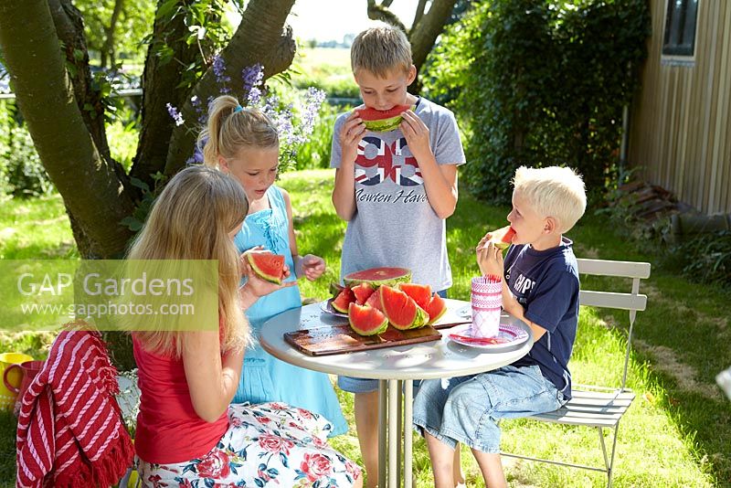 Children eating watermelon