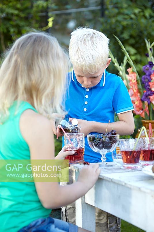 Boy pouring drink