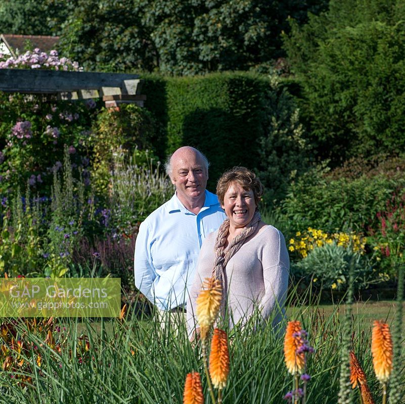 Mr and Mrs. Harry Rawlinson in their garden Abbeywood, a 45 acre garden featuring a vegetable garden, exotic garden, chapel garden, pool garden, woodland garden and lawned area with formal beds.