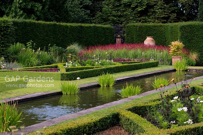 The Pool Garden at Abbeywood. A long reflecting pool is surrounded by formal box borders.