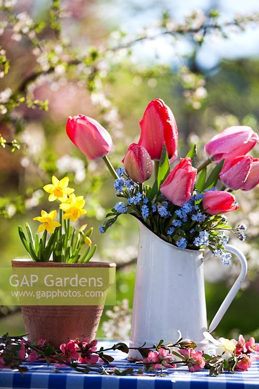 Floral arrangements of tulips, forget-me-nots and daffodils.