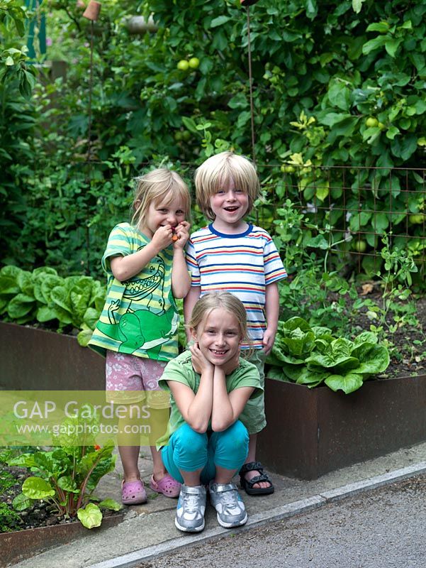 Children next to the veggie patch.