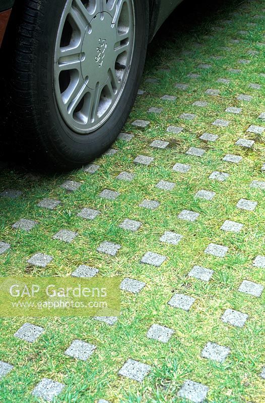 Concrete block and grass pavers in car park 