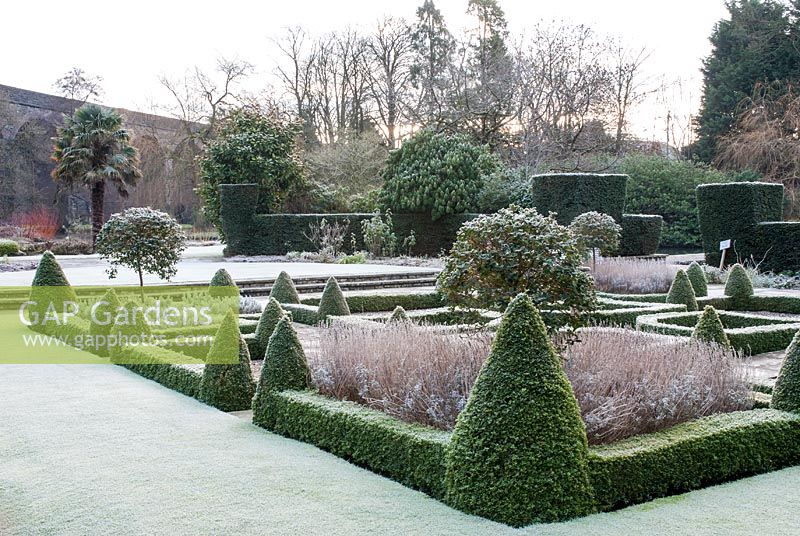 Box parterre in winter with viaduct in background - Kilver Court, Somerset