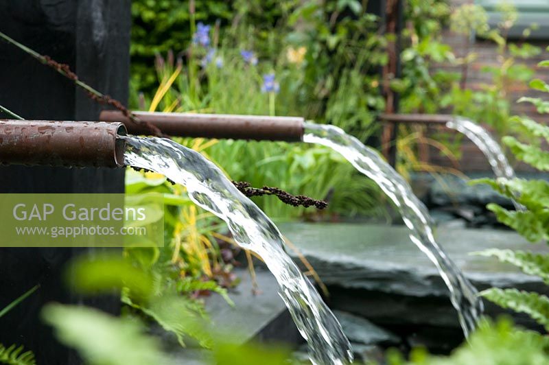 Ebb and Flow of water through copper piping  RHS 'Great Garden Challenge' Garden.  RHS Chelsea Flower Show, 2015