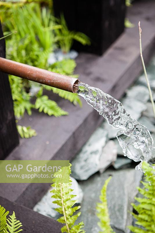 Detail of water spout.  The Great Chelsea Garden Challenge Garden. RHS Chelsea Flower Show, 2015.
