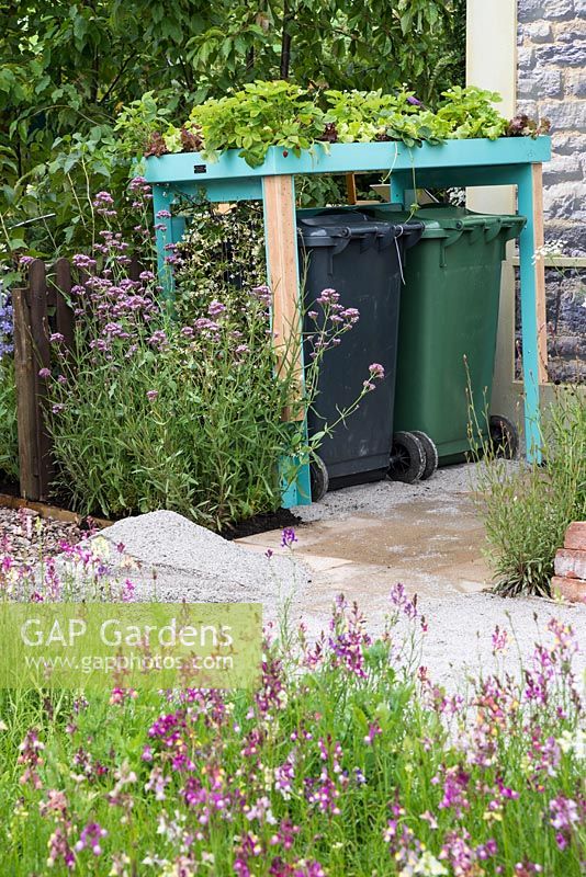 Wheelie bin housing with strawberries on a green roof - Community Street Garden, RHS Hampton Court Palace Flower Show 2015