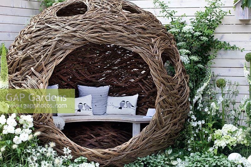 Spherical willow nest bird hide in Living Landscapes: City Twitchers garden at Hampton Court Palace Flower Show 2015