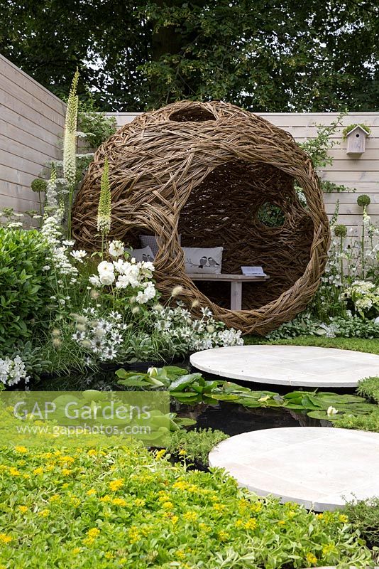 Living Landscapes: City Twitchers Garden - Chamomile nobile 'Treneague' lawn with stone stepping stones and patio, small pond with water lilies and  a rill - Designer CouCou Design, Sarah Keyser - Sponsor Living Landscapes - RHS Hampton Court Flower Show 2015 - awarded Silver gilt