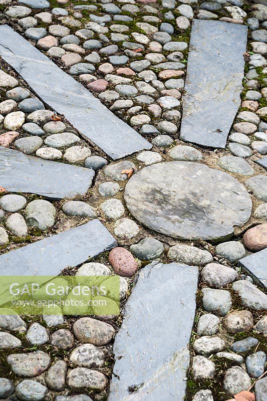 Decorative slate and pebble patterning on path. Plas Brondanw, Penrhyndeudraeth, Gwynedd, Wales