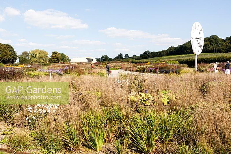 The Oudolf Field and view to the Ruddock Pavilion. Hauser and Wirth, Bruton, Somerset. Planting design by Piet Oudolf.