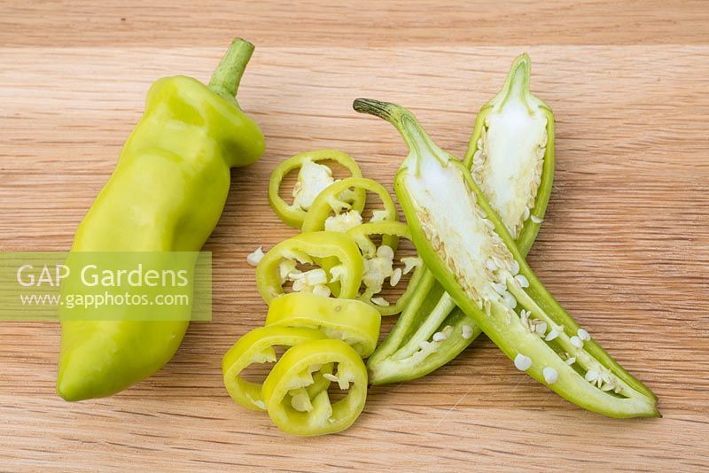 Pepper 'Hungarian Hot Wax' - Capsicum annuum fruit finely sliced on chopping board