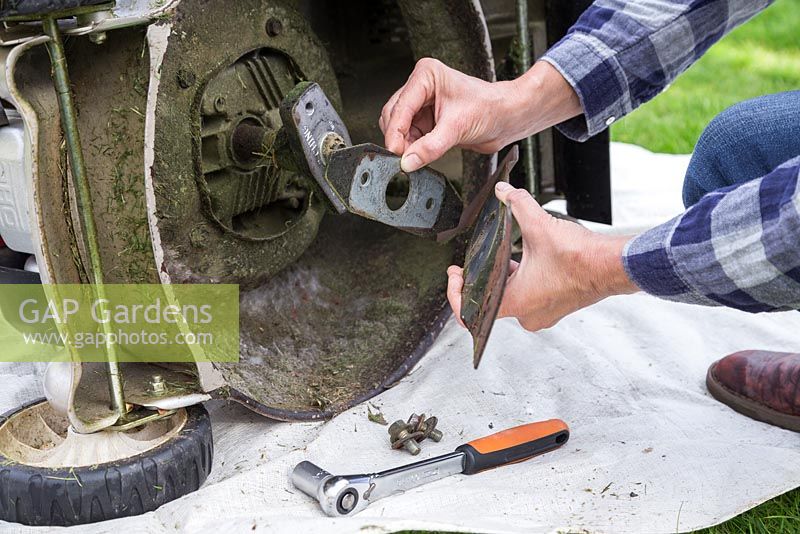 Carefully remove the mower blade sections and keep them together, so you know which way to correctly reattach them