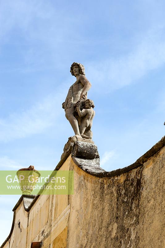 Painted stucco wall to side of the Villa and Bowling Green. Villa Gamberaia, Settignano, nr Florence, Tuscany, Italy. Septrmber. 