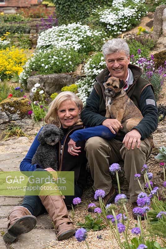 In the rockery at Alswick Hall, owners Mike and Annie Johnson with Ivy, a Highland terrier, and Twiglet, a miniature poodle.
