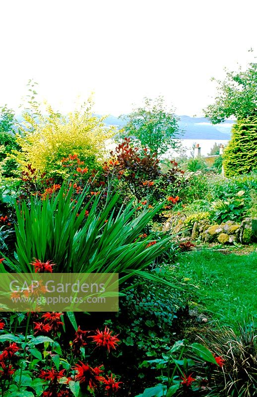 Abriachan. Loch Ness. Invernesshire, Scotland. The garden is situated on a hillside overlooking loch ness - with planting chosen to integrate with the surrounding environment
