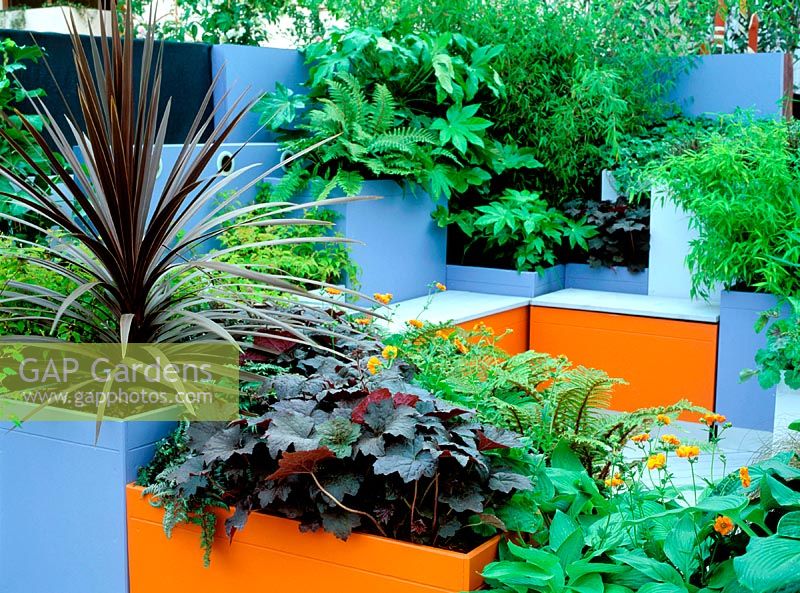 View over planters to seating area, Chelsea flower show, 2002: A moveable, modular garden. Design: Natalie Charles