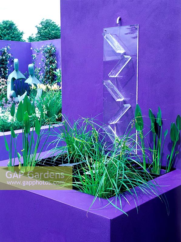 Perspex water cascade directs water into small raised pond. Design: Jane Mooney, a versatile garden for modern living, HCFS, 2002