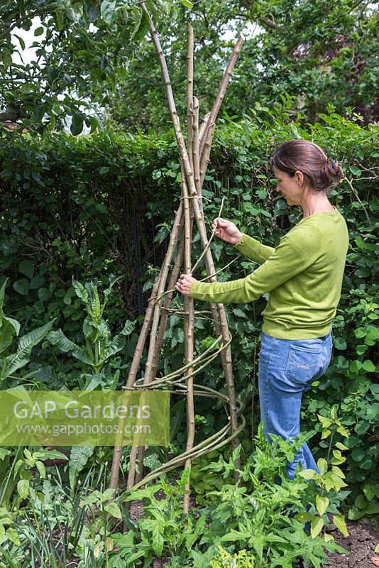 Weave the Willow between the Teepee, maintaining a spiral formation