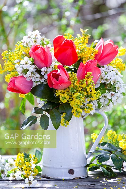 Jug with tulips, mahonia and pear blossom