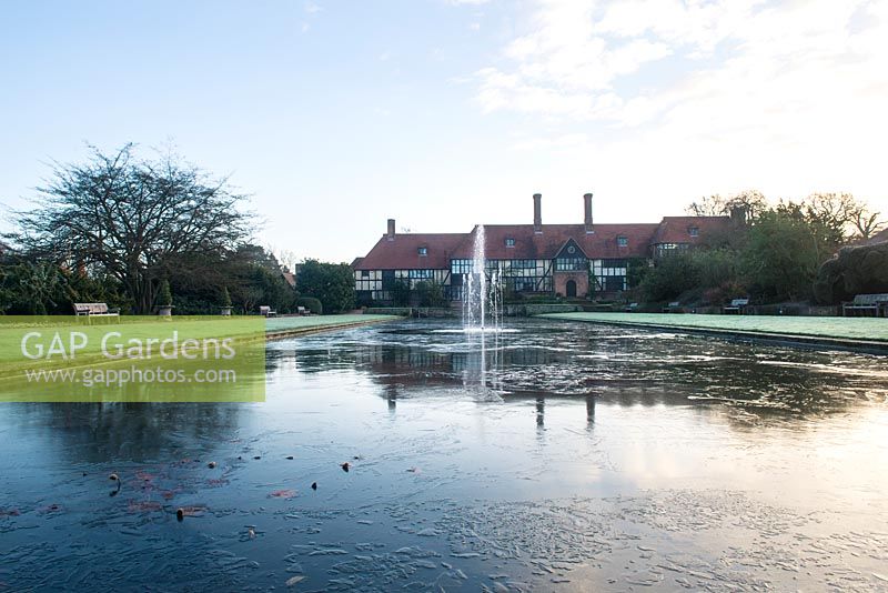 The laboratory with the canal and a fountain in winter, RHS Garden Wisley, Surrey 