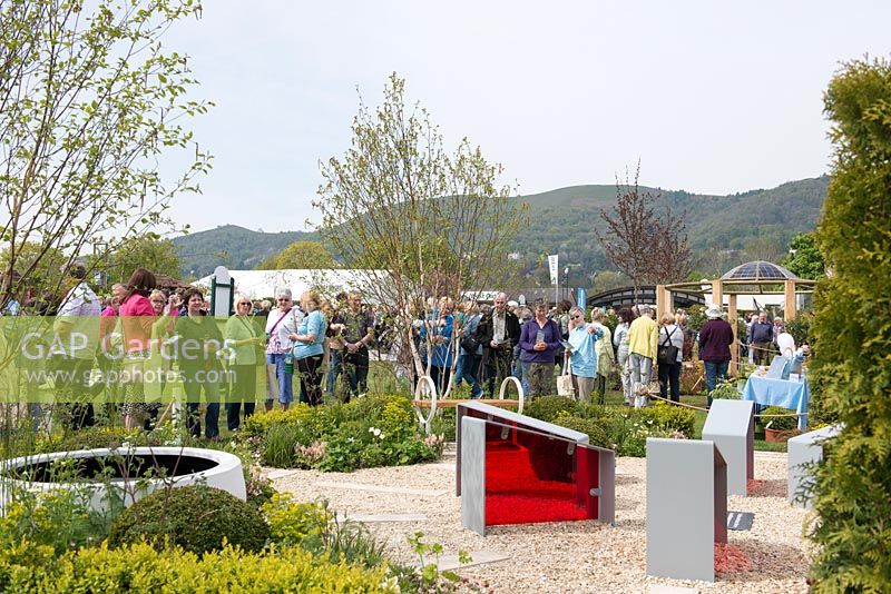 Visitors to the RHS Malvern Spring Festival 2016 looking at the 'Time is a Healer' garden