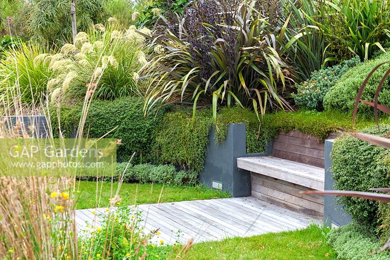 Wooden integral bench and decking at Bhudevi Estate garden, Marlborough, New Zealand.