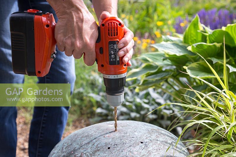 Place the vintage copper planters upside down and use a drill to create drainage holes