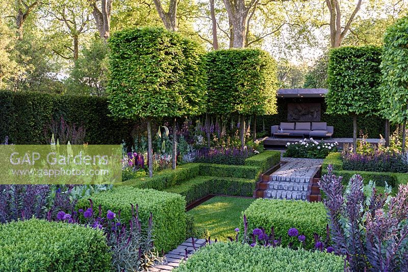 The Husqvarna Garden. Formal garden with clipped Hornbean Aerial hedging and sunken lawn. RHS Chelsea Flower Show 2016, Designer: Charlie Albone, Sponsors: Husqvarna