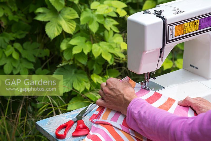 Use a sewing machine to create a deck chair cover from the fabric