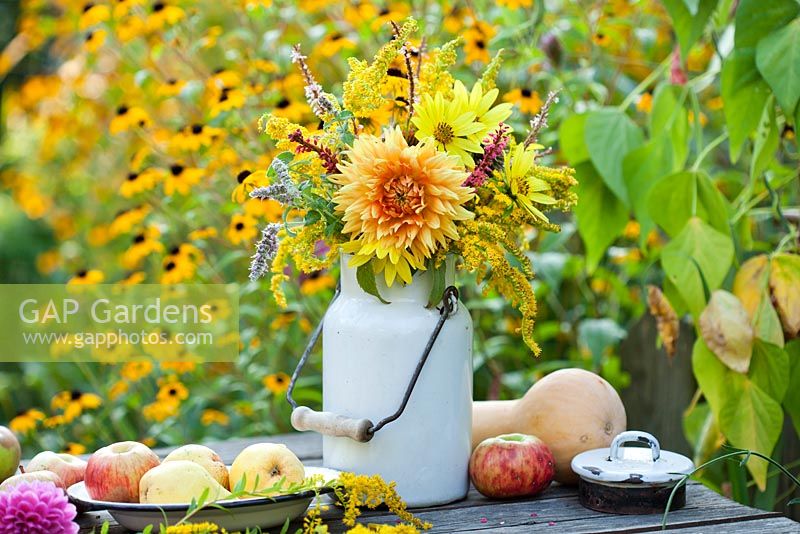 Jug of summer flowers - dahlia, sunflower, Persicaria, Solidago.